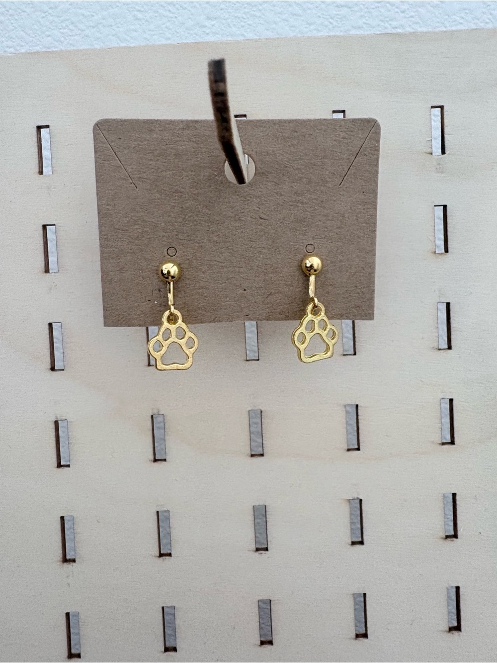 Handcrafted gold dog paw charm clip on earrings